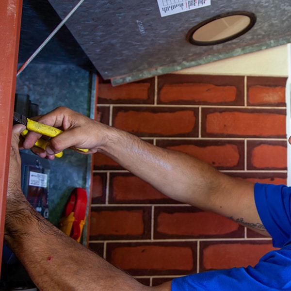 Electrician inspecting a residential electrical fault