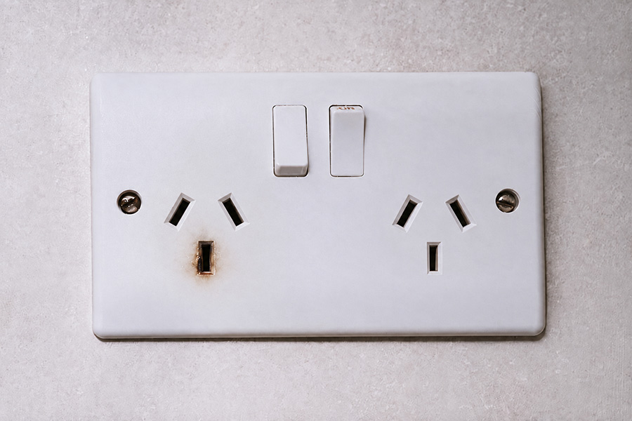 Australian residential power point showing signs of electrical scorching and damage