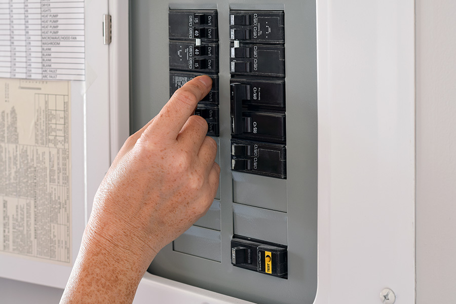 Checking the switchboard during a no hot water emergency