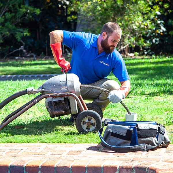 Plumber inspecting an emergency plumbing problem in Perth