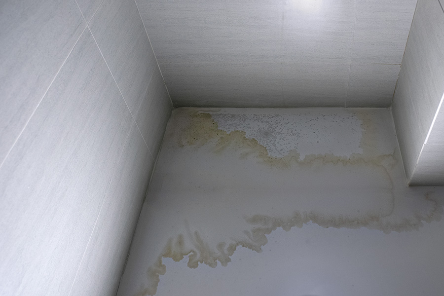 Water damage from a burst pipe inside a wall